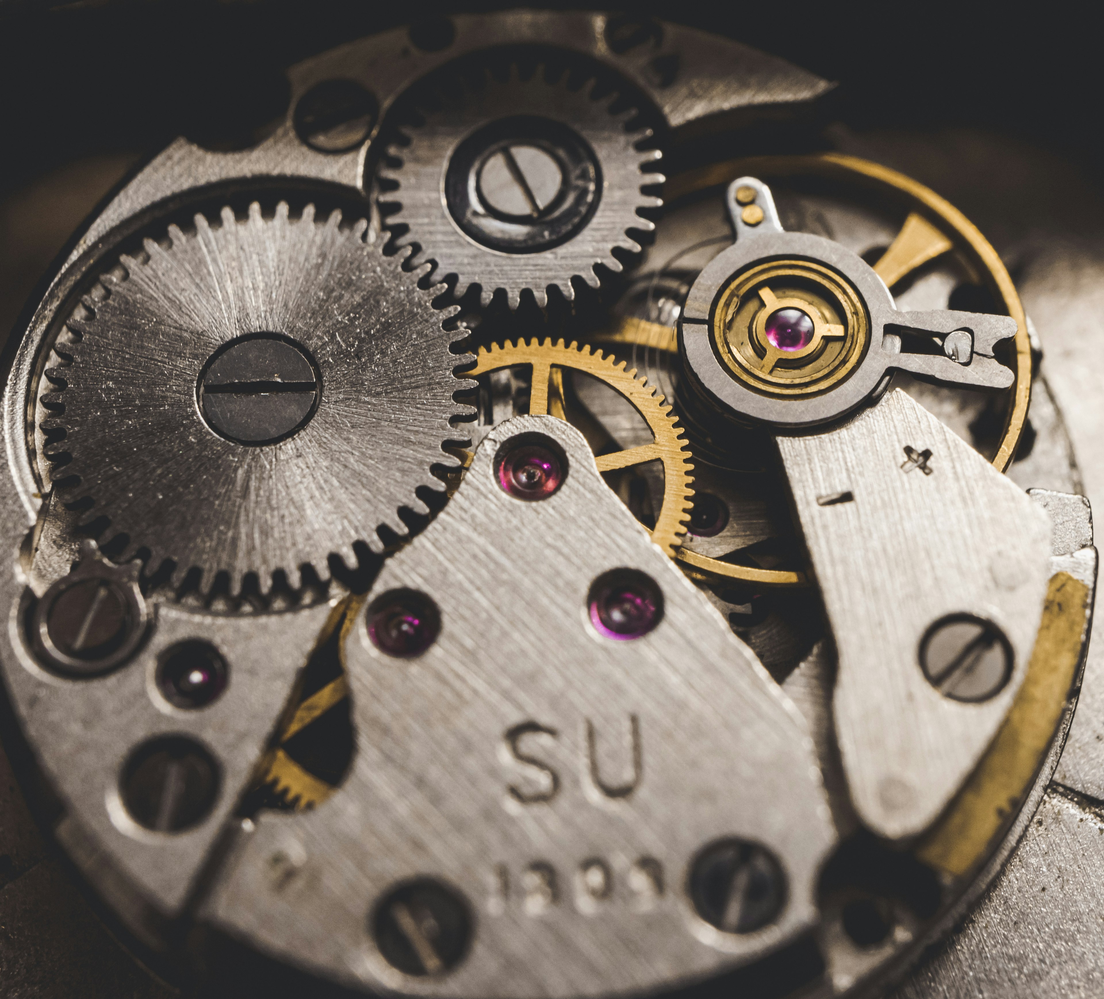 Close-up of a mechanical watch movement serviced at Saleh Jewelers